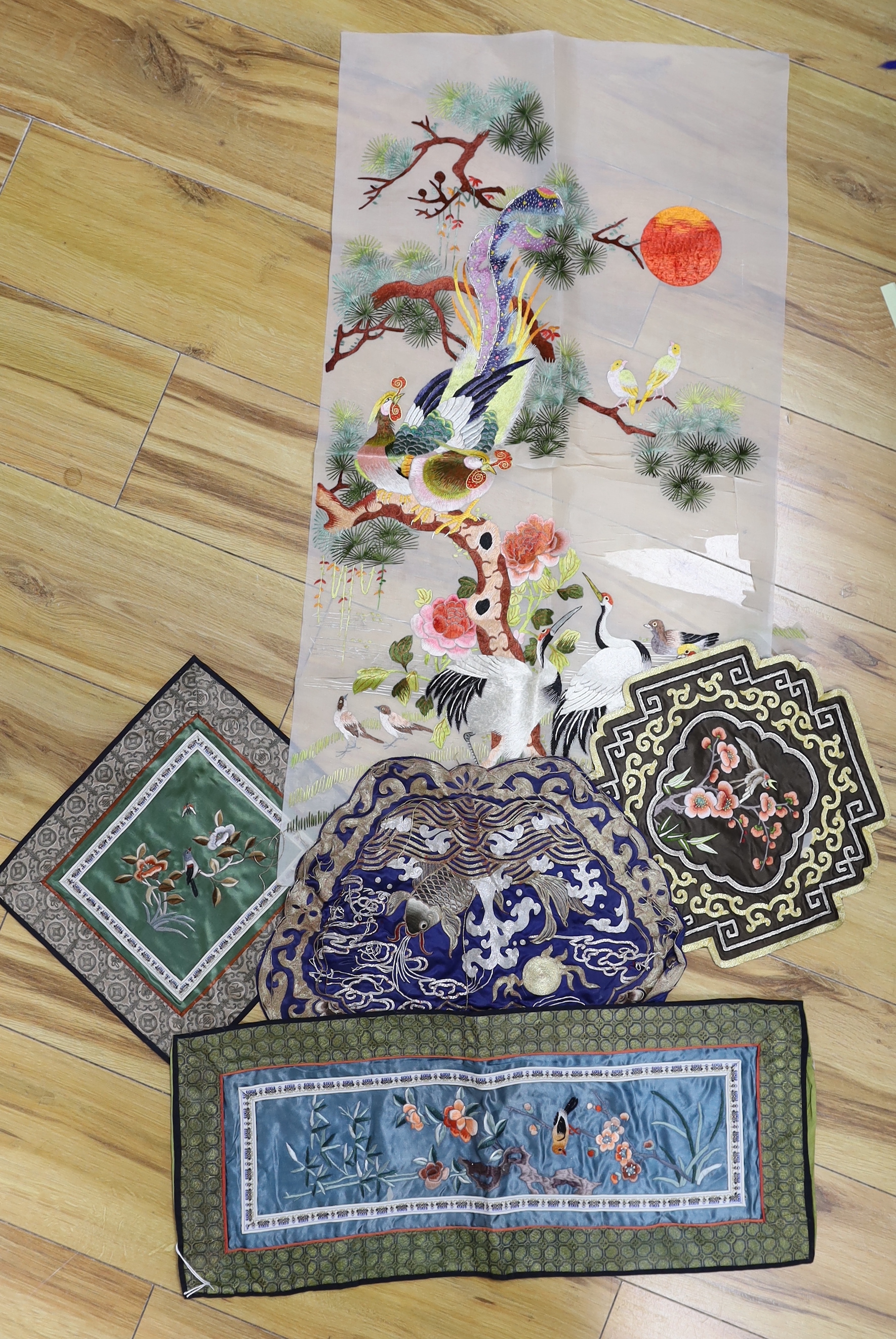 Five Chinese embroideries including one with gilt thread and one gauze example embroidered with birds